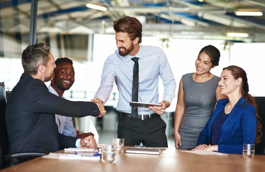 A collaborative business meeting highlighting managerial effectiveness and leadership strategies to build employee loyalty in Orlando, FL.