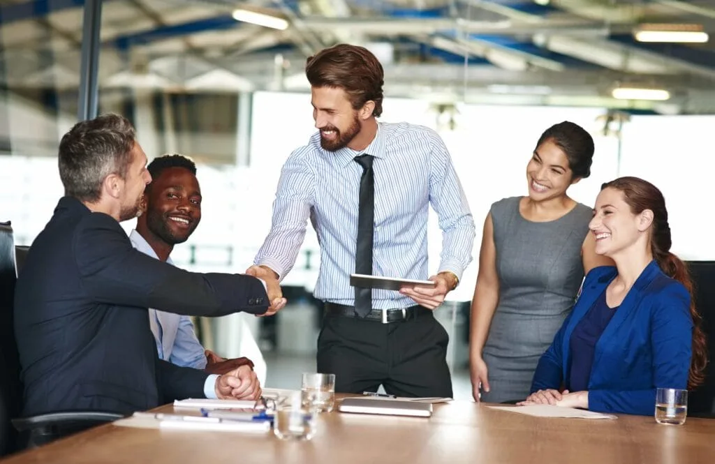 A collaborative business meeting highlighting managerial effectiveness and leadership strategies to build employee loyalty in Orlando, FL.