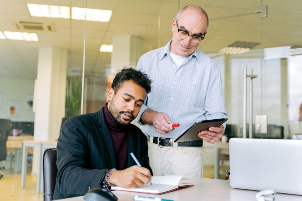 How Are Leading Employers Gathering Employee Feedback at Scale in 2026? 1 manager reviewing employee feedback pulse dashboard on tablet